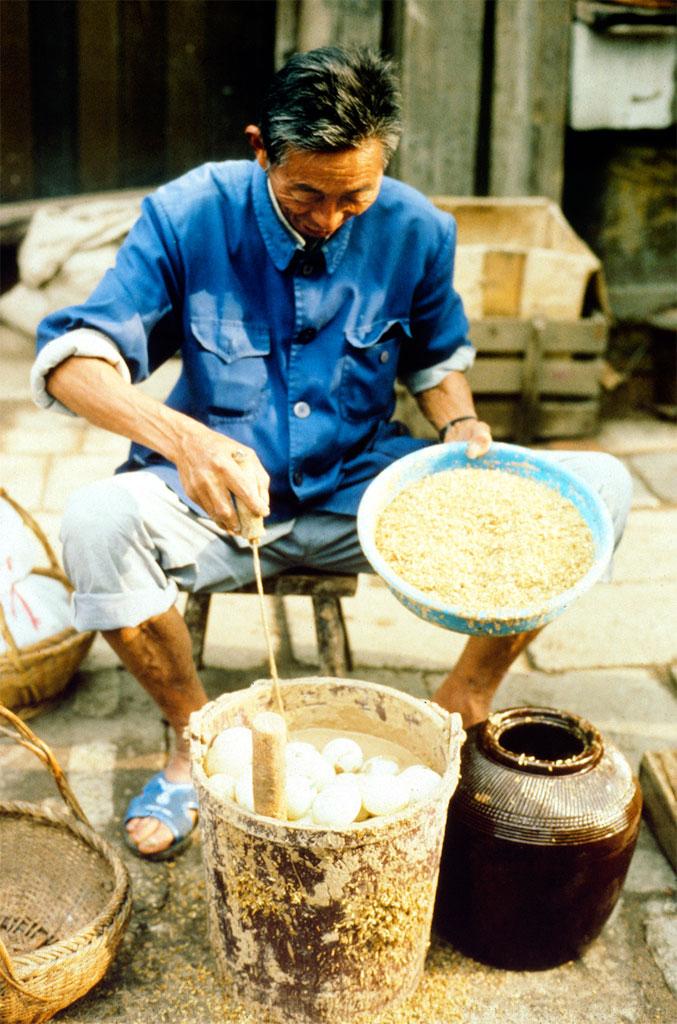 Shanghai - A man is preparing thousand-year eggs
