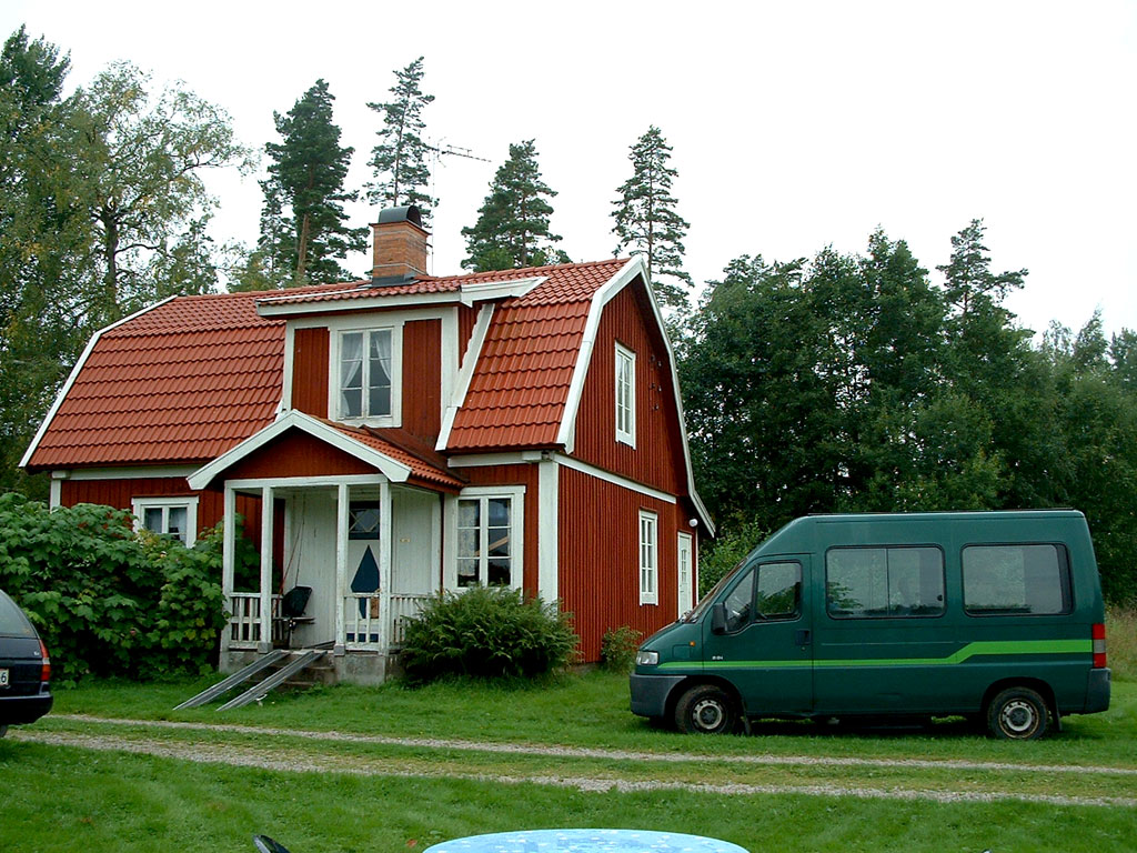 The "Brock mobile" is parked beside a rented cottage