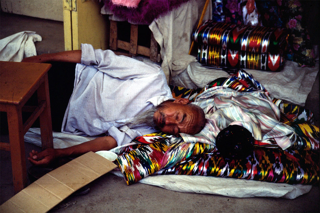 Sleeping trader in a bazaar in Urumqi in Xinjiang Province